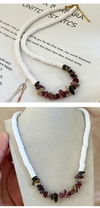 Close-up of heishi beads and natural crushed stone necklace on a jewelry display stand