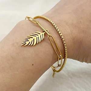 Double-layered 18K gold plated stainless steel bracelet with a hollow leaf pendant