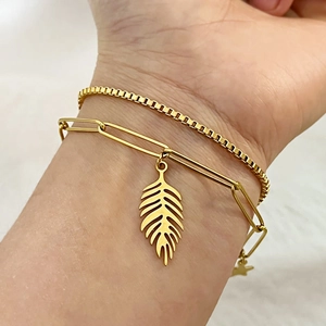 Double-layered 18K gold plated stainless steel bracelet with leaf and star charms
