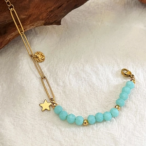 Retro gold paperclip chain and blue faceted bead bracelet with star charms
