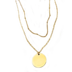 Double-layered gold pendant necklace with smooth circular charms and bead accents