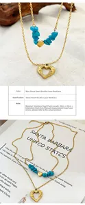 Detail of layered gold stainless steel necklace with turquoise stones and heart pendants