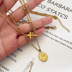 Layered 18k gold stainless steel necklace with Virgin Mary and cross pendants