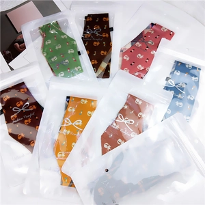 Various cute cartoon printed long silk scarves with fox and cat patterns in clear packaging