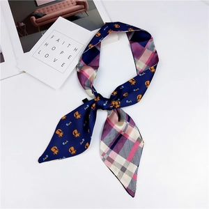 Close-up of double-sided skinny scarf with cartoon cat prints and plaid pattern