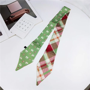 Detailed view of a double-sided cartoon cat and plaid silk twilly scarf for decoration