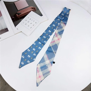 Navy blue twilly scarf with cartoon cat print and pink check pattern detail
