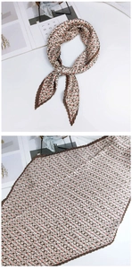 Détail d'un foulard en soie plissé à losanges marron et rose avec des bords pointus fins