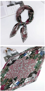 Détail d'un foulard en soie plissé avec imprimé zèbre et motifs abstraits rose et vert