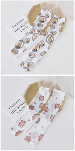 Detail of breathable white mesh sun sleeves with cute pear and floral bear patterns