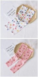 Detail of mesh sun protection sleeves with cute strawberry and floral print patterns