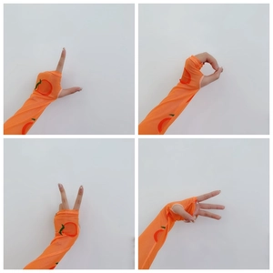 Detailed view of orange mesh arm sleeves with peach patterns and thumb hole design