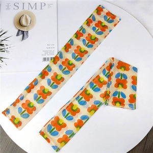 Detail of floral mesh sun protection sleeves with vintage orange and blue flower patterns