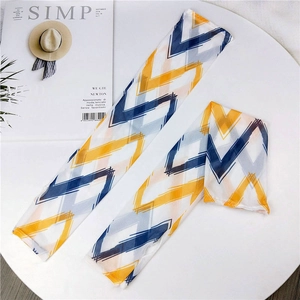 Detail of blue and yellow geometric pattern on breathable mesh sun protection sleeves
