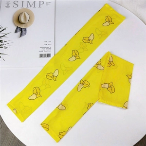 Detail of yellow ice silk sun sleeves featuring cute cartoon banana prints and smooth texture