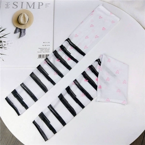 Close-up of mesh sun protection sleeves with black stripes and pink heart patterns