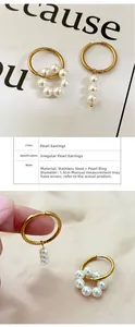 Detail of asymmetric stainless steel earrings featuring geometric pearls and gold finish