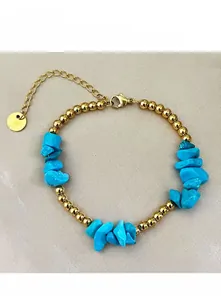 Detail of 18K gold plated beaded bracelet with blue turquoise stones and lobster clasp
