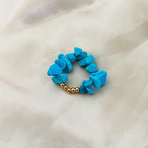 Elastic beaded ring featuring natural blue gravel stones and gold accent beads for women