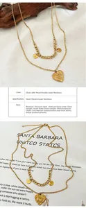 Detailed view of gold double-layered titanium steel necklace with heart and stone charms