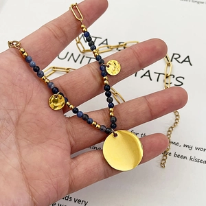 Bohemian gold chain necklace with blue stone beads and hammered round metal pendants