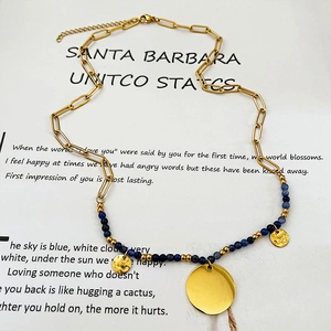 Gold chain necklace with blue stone beads and triple hammered circular metal pendants