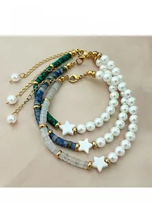 Detailed set of three beaded bracelets with white pearls, stars, and colorful stones