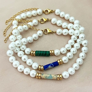 Three beaded pearl bracelets with natural stone pendants and golden lobster clasps