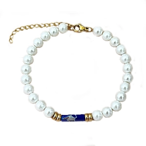 Elegant pearl bead bracelet with blue marble bead and adjustable gold clasp on white background
