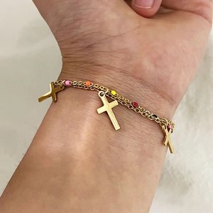 Golden double-layered titanium steel bracelet featuring colorful beads and cross pendants