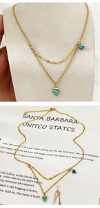 Close-up of double-layer 18K gold-plated necklace with irregular heart turquoise pendants