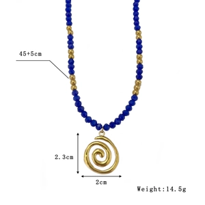 Blue natural stone beaded necklace with a golden spiral pendant and stainless steel charm