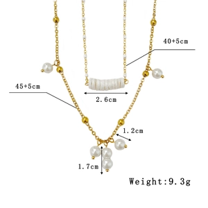Double-layer stainless steel necklace with baroque pearls and gold beads on white background