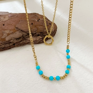 Layered 18K gold-plated stainless steel necklace with blue beads and ring pendant