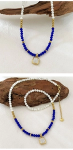 Detailed macro view of beaded blue crystal necklace with square rhinestone pendant