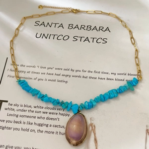 Bohemian multi-layer necklace with turquoise stones and purple shell pendant on gold chain
