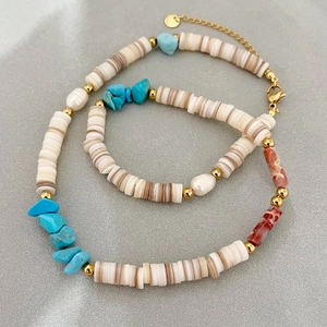 Bohemian beaded necklace featuring turquoise, shell chips and a white baroque pearl charm