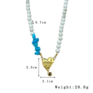 Bohemian beaded necklace with white marble beads, turquoise accents and gold heart pendant