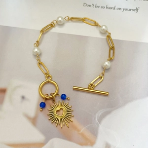 18K gold plated pearl bracelet with heart sun charm and blue beads with OT clasp