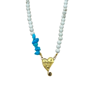Bohemian beaded necklace with turquoise stones and gold heart landscape pendant