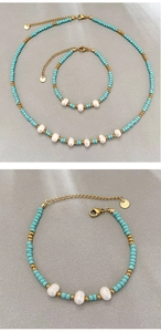 Detail of bohemian turquoise beaded necklace and bracelet set with freshwater pearls