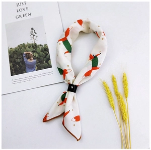 Detail of white cotton linen scarf with red fox print and a black leather loop fastener