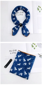 Detail of navy blue cotton linen scarf with white monkey print and leather fastener