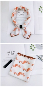 Detail of floral cotton linen square scarf with origami crane print and leather buckle
