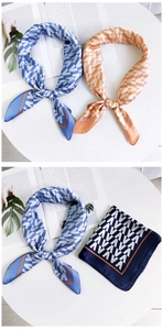 Détail d'un foulard en soie montrant des motifs géométriques bleu et orange lisses