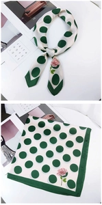 Close-up of polka dot silk scarf with rose print shown in knotted and flat view