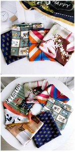 Flat lay of multiple colorful cartoon printed satin scarves for professional styling