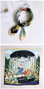 Detail view of cartoon silk scarf with blue illustrations and yellow border on a white magazine