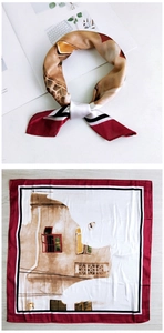 Detail of architectural print silk scarf with red border and building pattern
