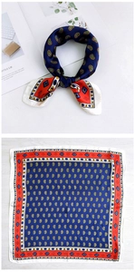 Detail view of navy blue and red paisley silk square scarf with satin finish and geometric border